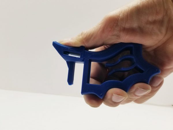 Blue BulletBlaster universal magazine loader held in one hand